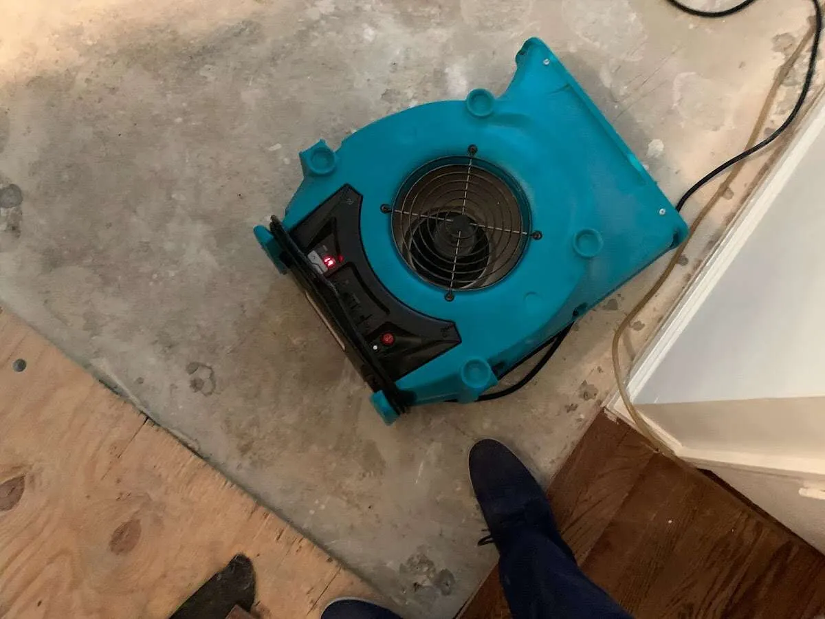 Air mover drying subfloor during Leak Detection & Repair in Green River